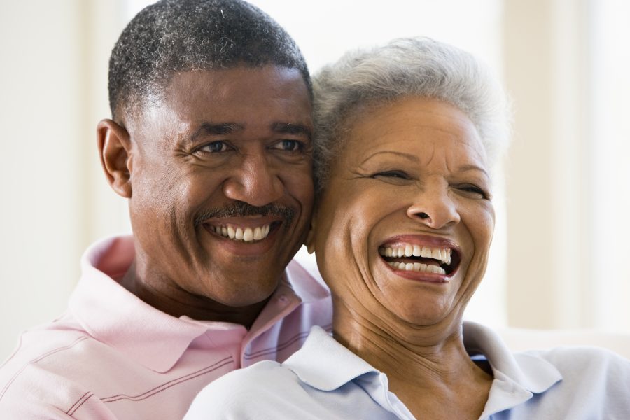 Older couple sharing a lighthearted, intimate moment in retirement