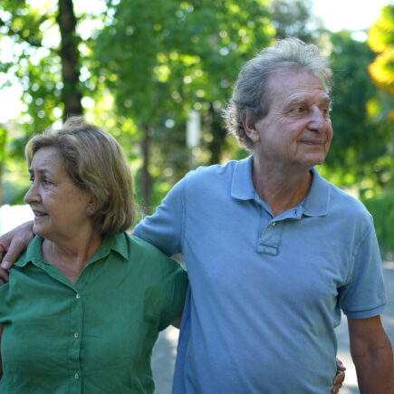 Retired couple walking on a nature path, symbolizing a clear and purposeful retirement journey