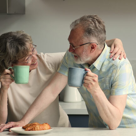 Smiling retired couple reflecting on lessons learned after seven years of retirement.