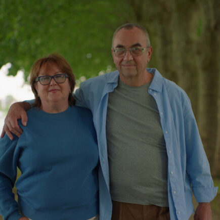 Retired couple taking a morning walk instead of watching TV.