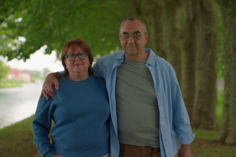 Retired couple taking a morning walk instead of watching TV.